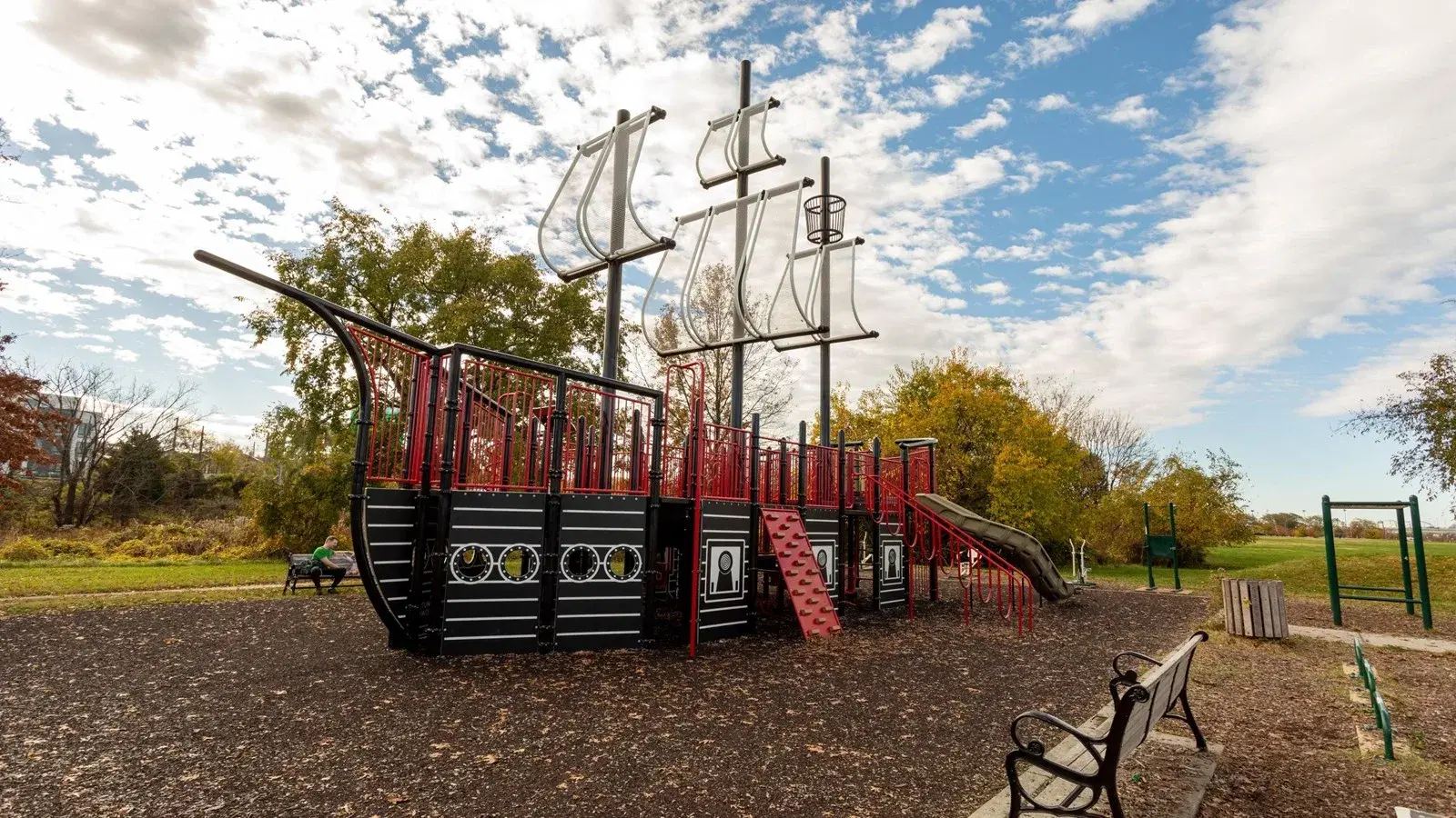The pirate ship playground at the Fairlawn picnic area in Anacostia Park, Washington, D.C., under an autumn sky.