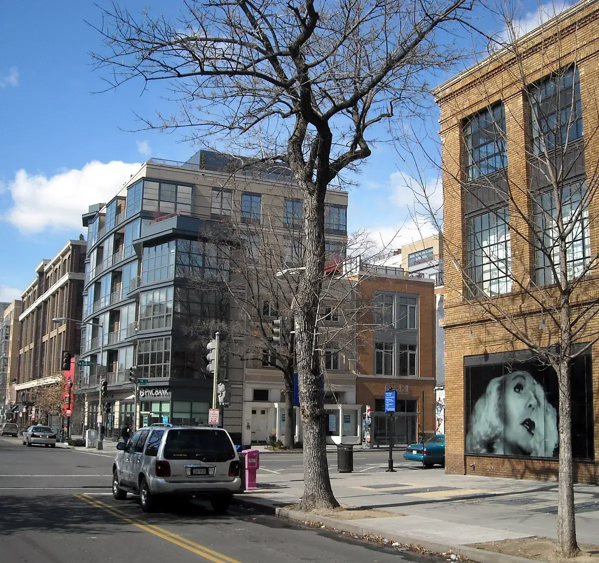 The corner of 14th and P streets NW, with the Studio Theatre's brick wall at right and newer buildings across the street