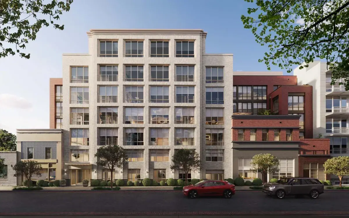 Rendering of 14Church from Church Street, a pale brick building with red brick wings above two low older storefronts