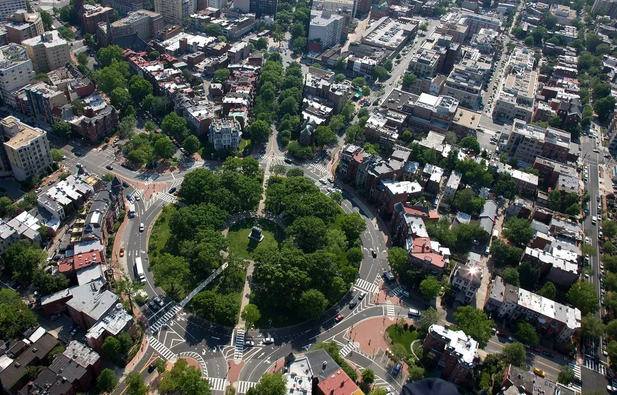 Logan Circle from the air, a round park of trees with rowhouse blocks and avenues running out from it