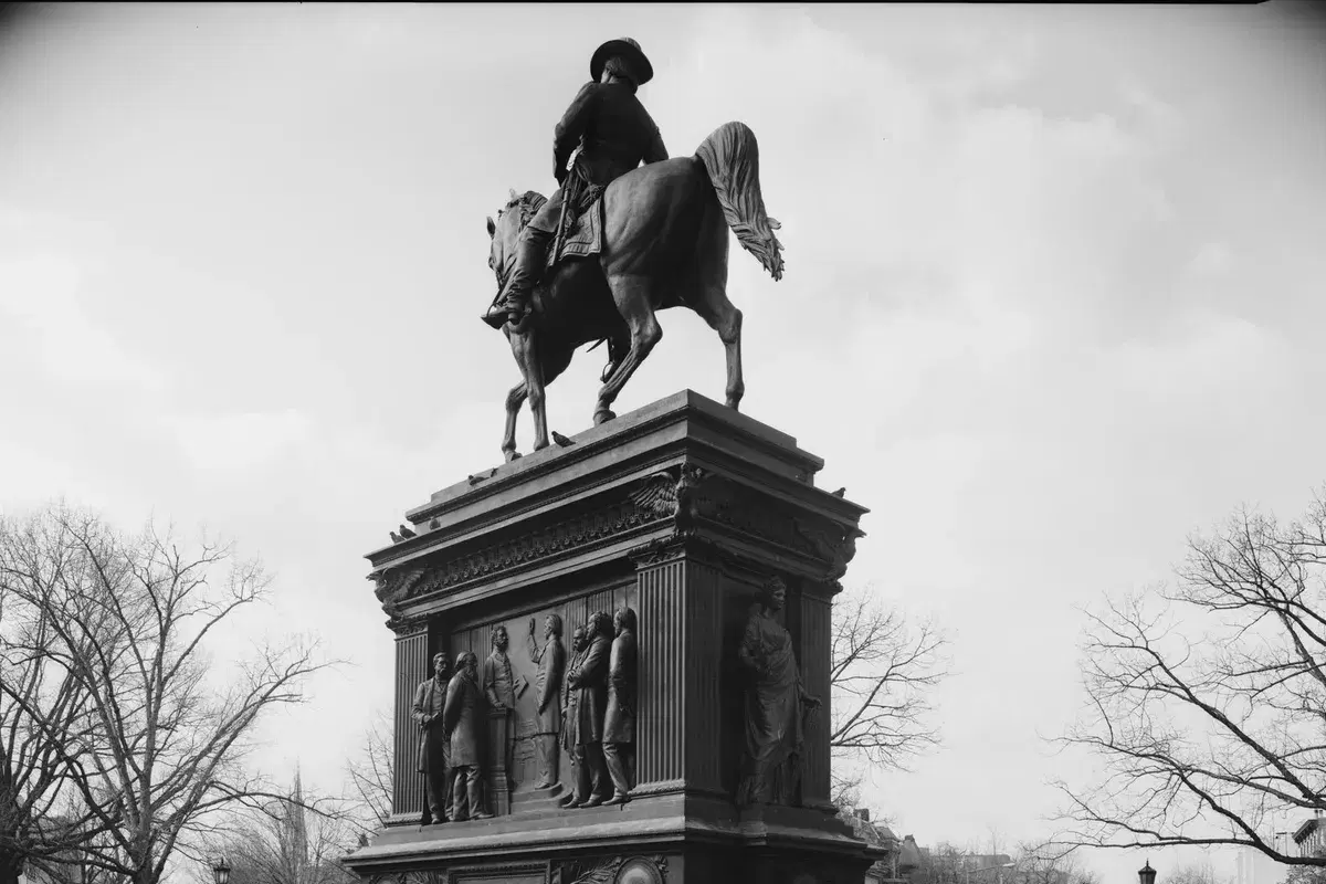 The bronze statue of Gen. John A. Logan on horseback on its tall bronze base, bare trees around it
