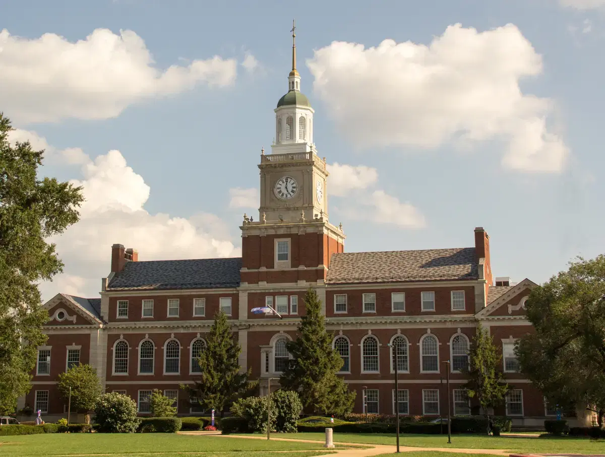 The clock tower of Founders Library at Howard University at golden hour, Washington, D.C.