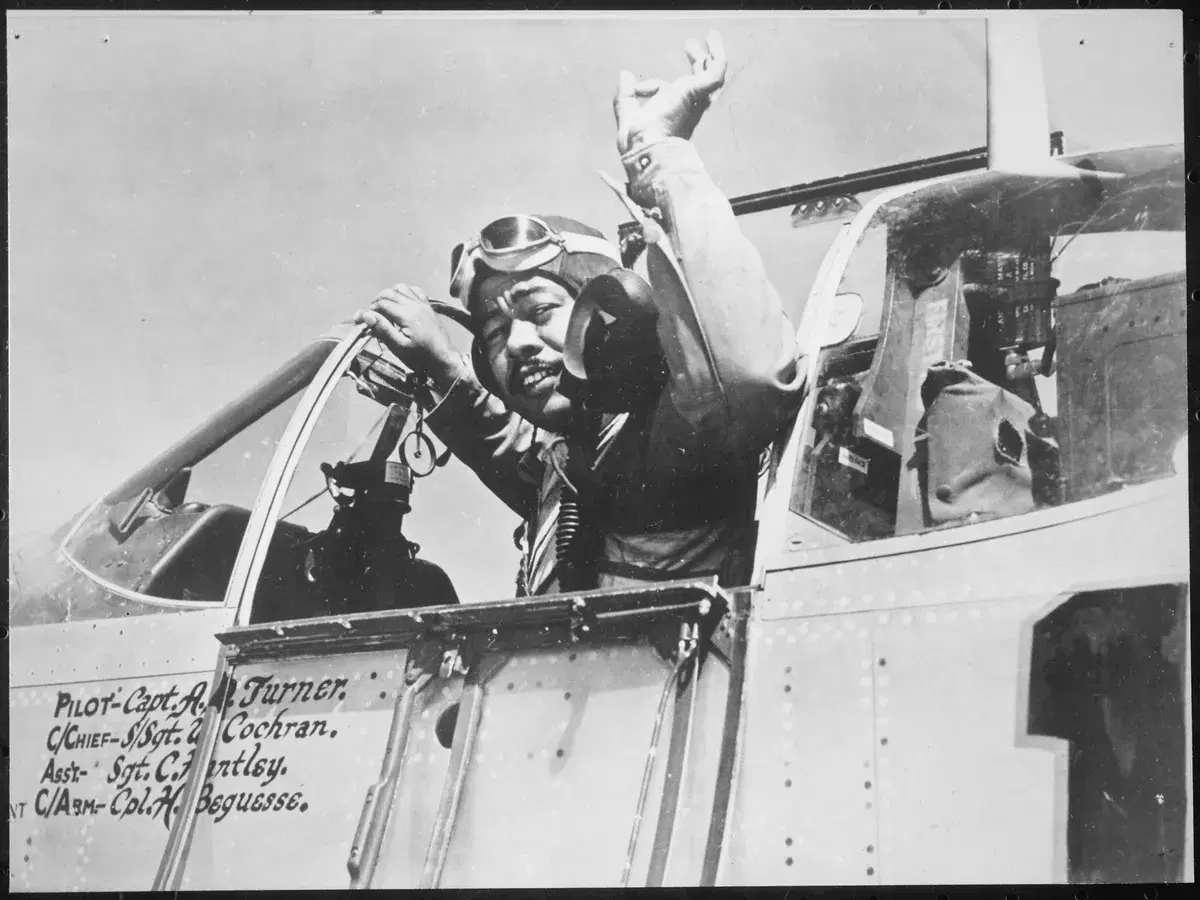 Capt. Andrew D. Turner in the cockpit of his P-51 fighter, about September 1944, with his name painted on the fuselage