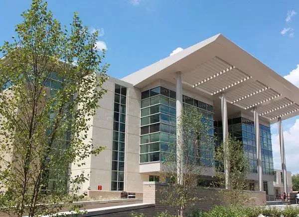 H.D. Woodson High School's glass-and-stone building with its large louvered canopy