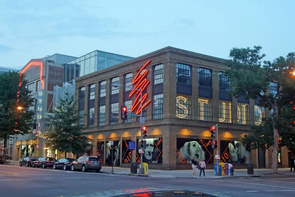 The Studio Theatre's corner at 14th and P Streets NW at twilight, with red neon and lit STUDIO window letters, Washington, D.C.