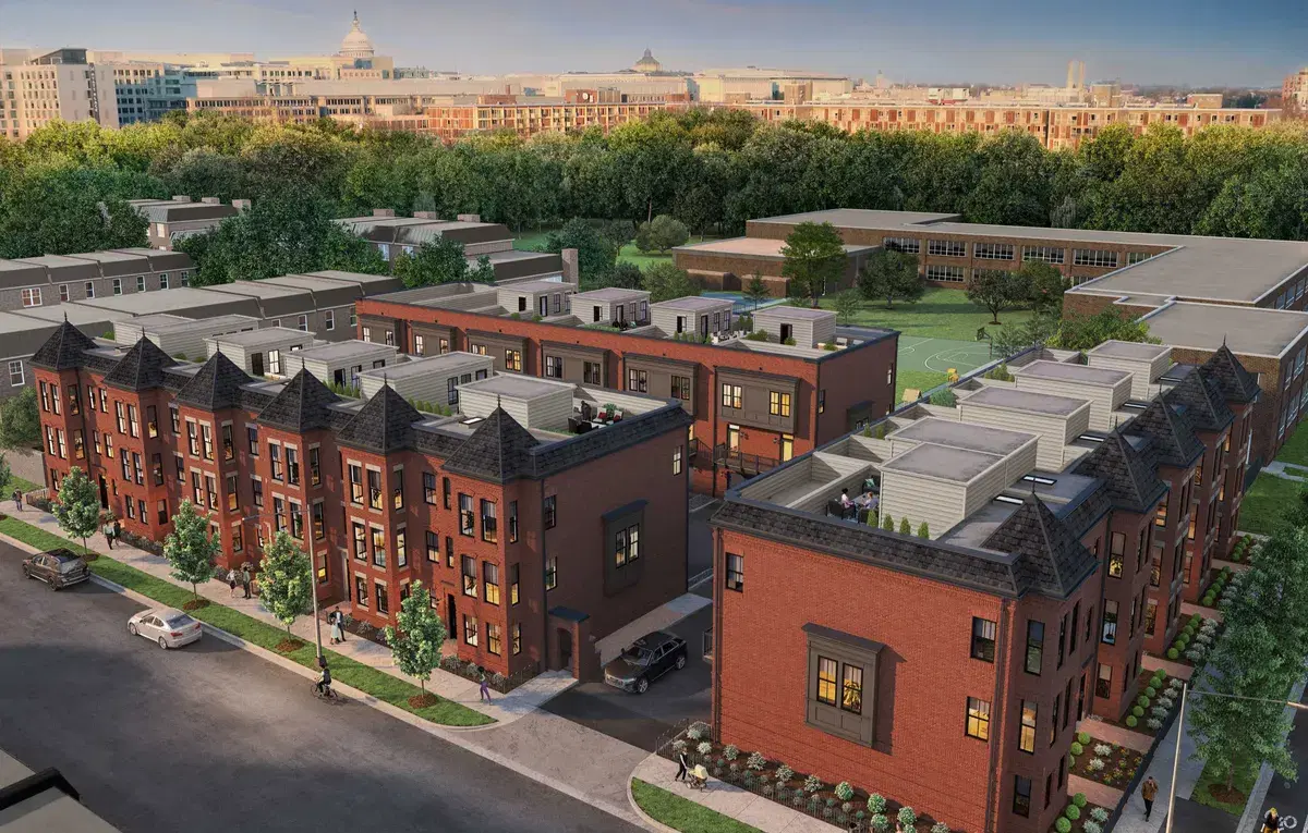 Rendering of Lynden Row's red-brick brownstones with turret roofs and rooftop terraces, the Capitol dome in the distance