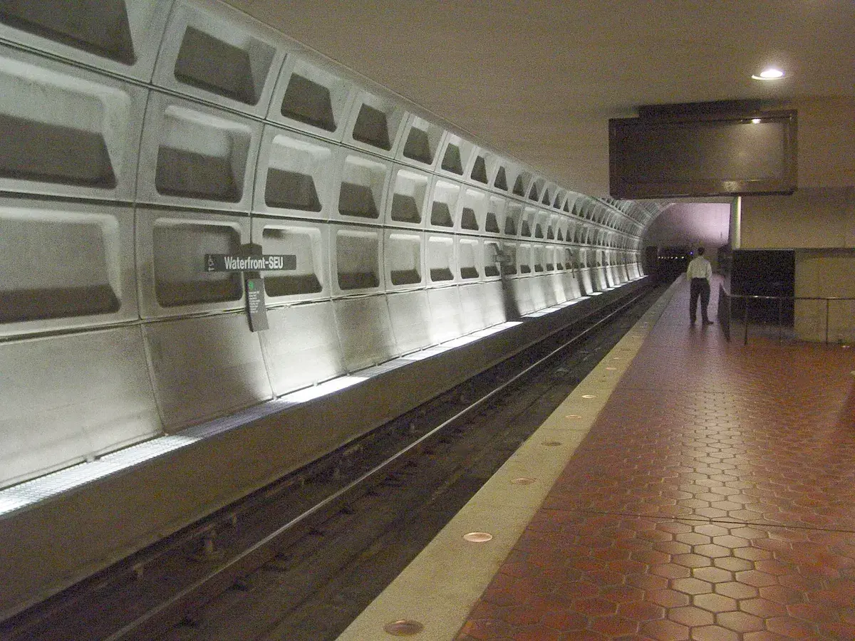 The platform at the Waterfront-SEU Metro station, with the station name on a sign on the wall