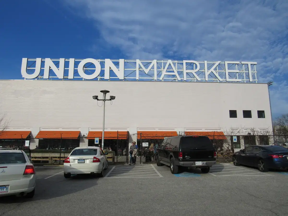 The UNION MARKET rooftop sign above the market's white facade and orange awnings, Washington, D.C.