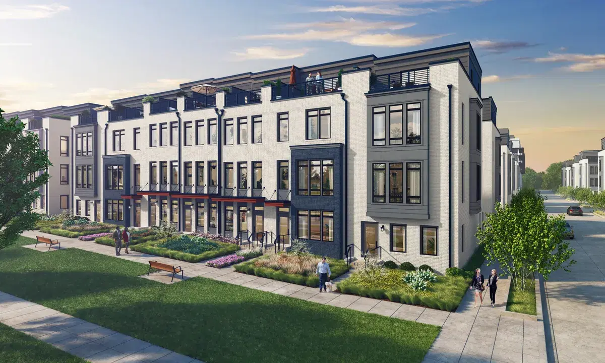 Rendering of four-story Chatfield townhomes on a corner, in white brick with dark bays, beside a lawn