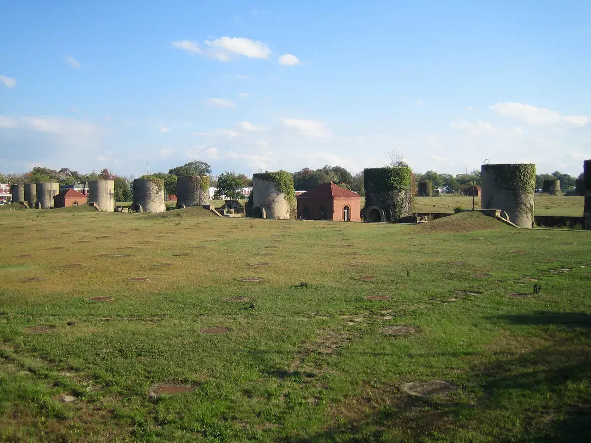Sand bins and a red-roofed regulator house across the grass that covered the filter beds
