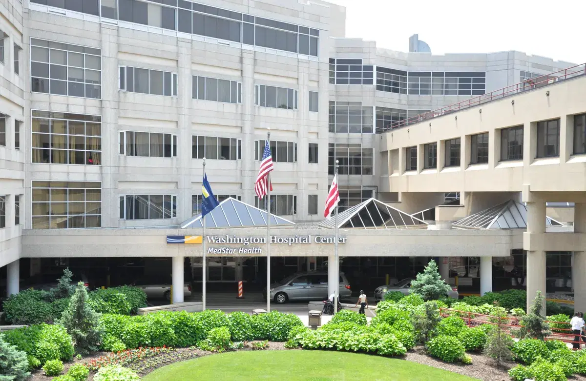 The main entrance of MedStar Washington Hospital Center, with flags and a planted circle in front
