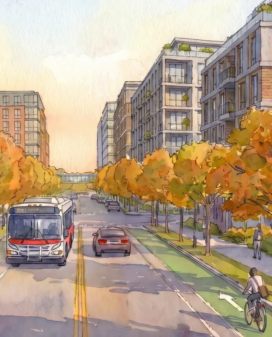 Rendering of a Metrobus on a tree-lined Constitution Avenue NE with a protected bike lane and new apartment buildings