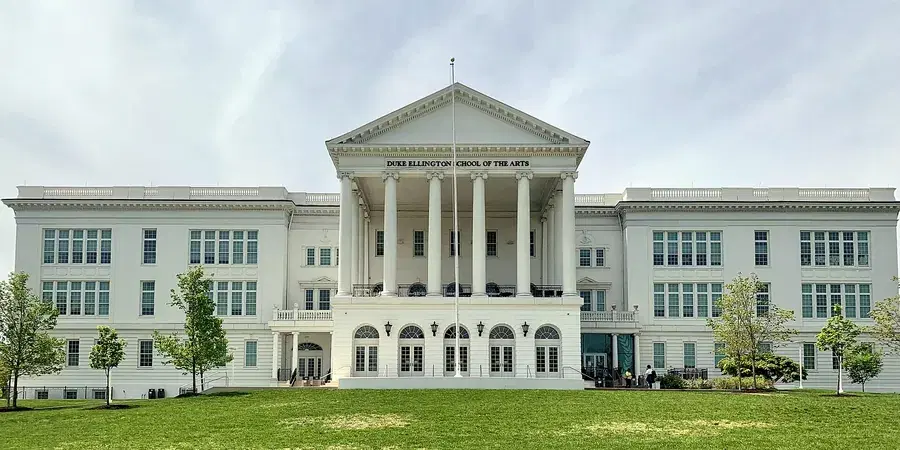 The white neoclassical facade of the Duke Ellington School of the Arts at 35th and R Streets NW, Georgetown, Washington, D.C.