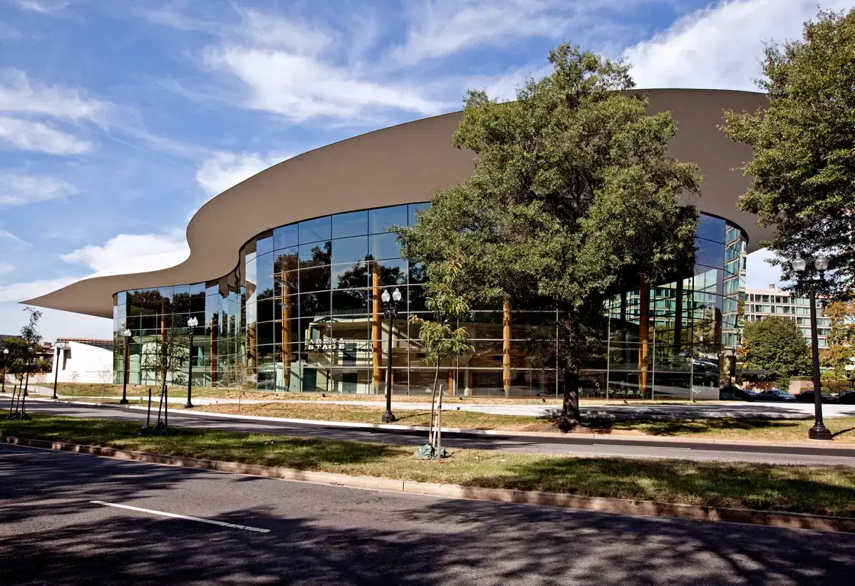 The curved glass facade and swooping roof of Arena Stage's Mead Center on Maine Avenue SW, Washington, D.C.
