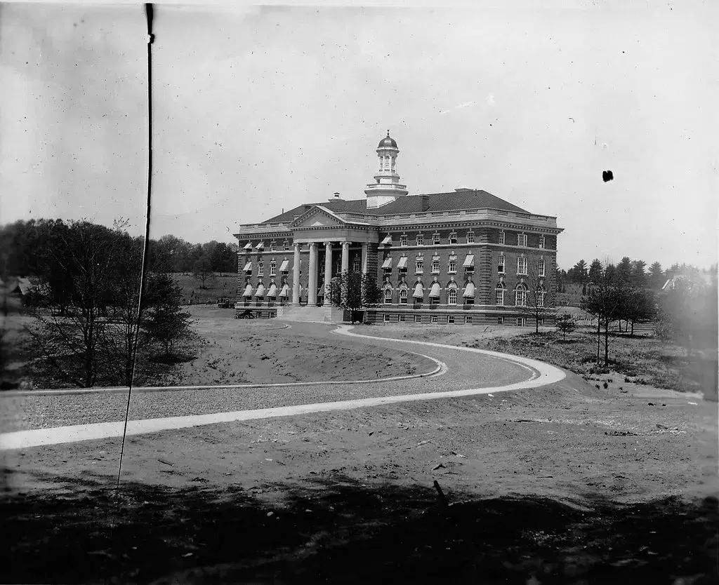 The newly built main hospital building with its cupola, standing on bare ground with a new curving drive
