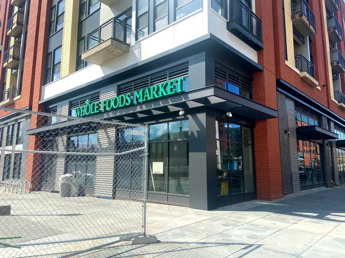 The Whole Foods Market storefront on the ground floor of The Hartley