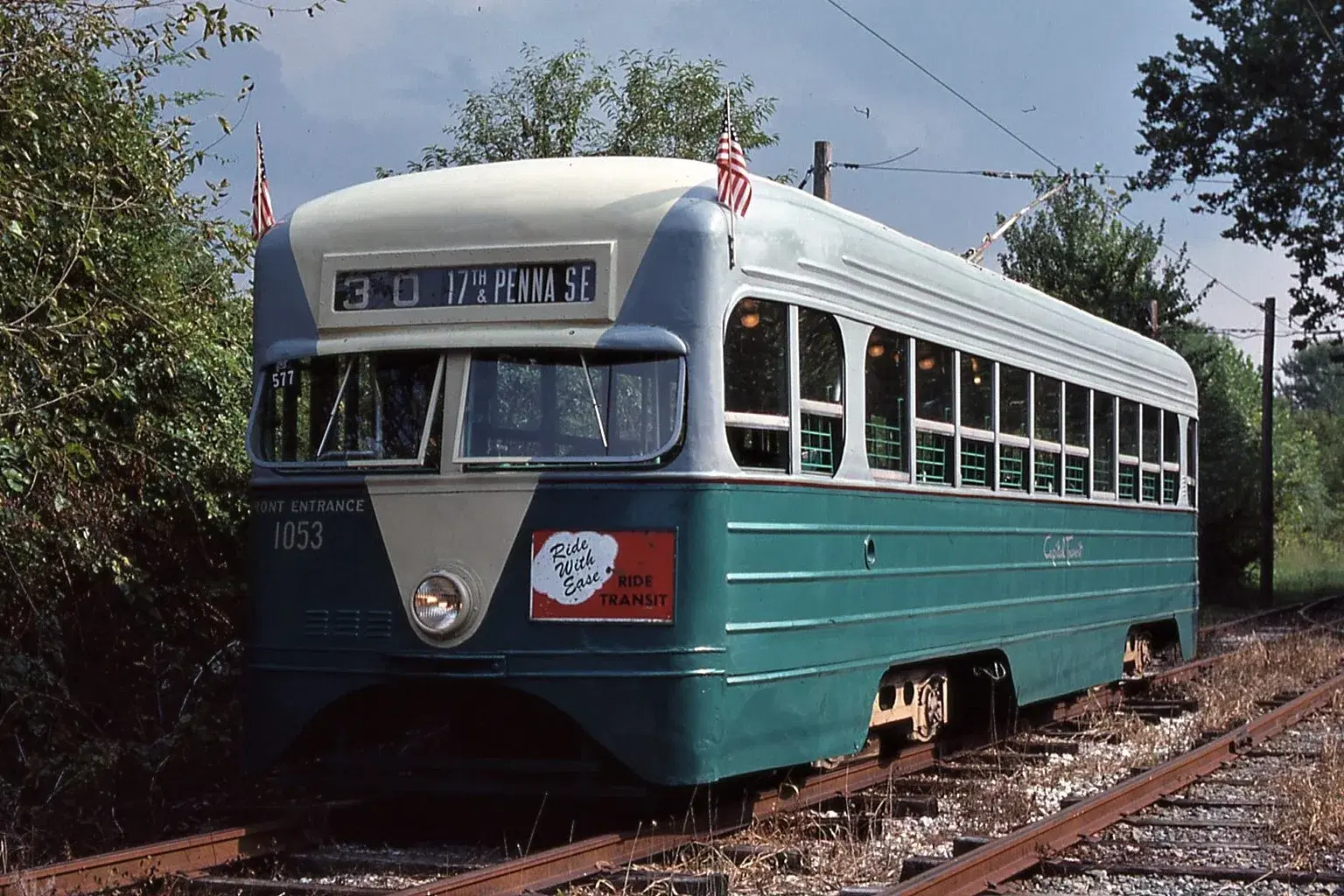A preserved Capital Transit streetcar in green and cream, its destination sign reading 30 — 17th & Penna SE, the Pennsylvania Avenue SE route.