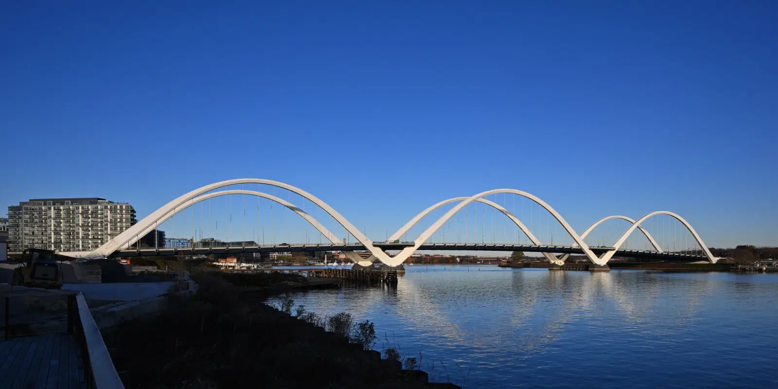 The white arches of the Frederick Douglass Memorial Bridge over the Anacostia River.