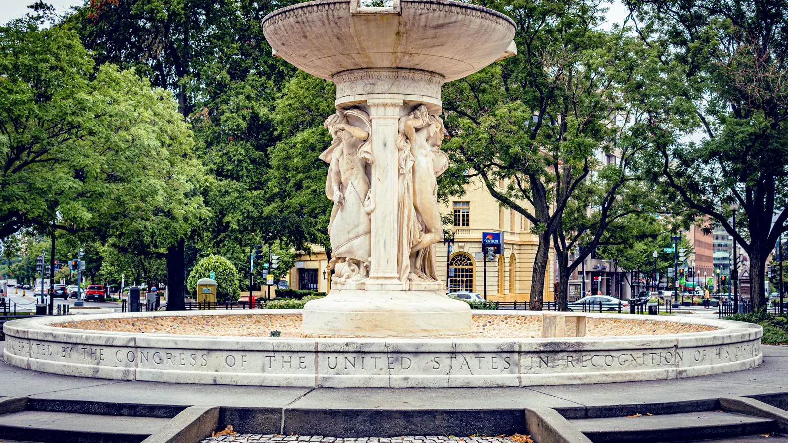 The marble fountain at the center of Dupont Circle with people gathered around it, Washington, D.C.