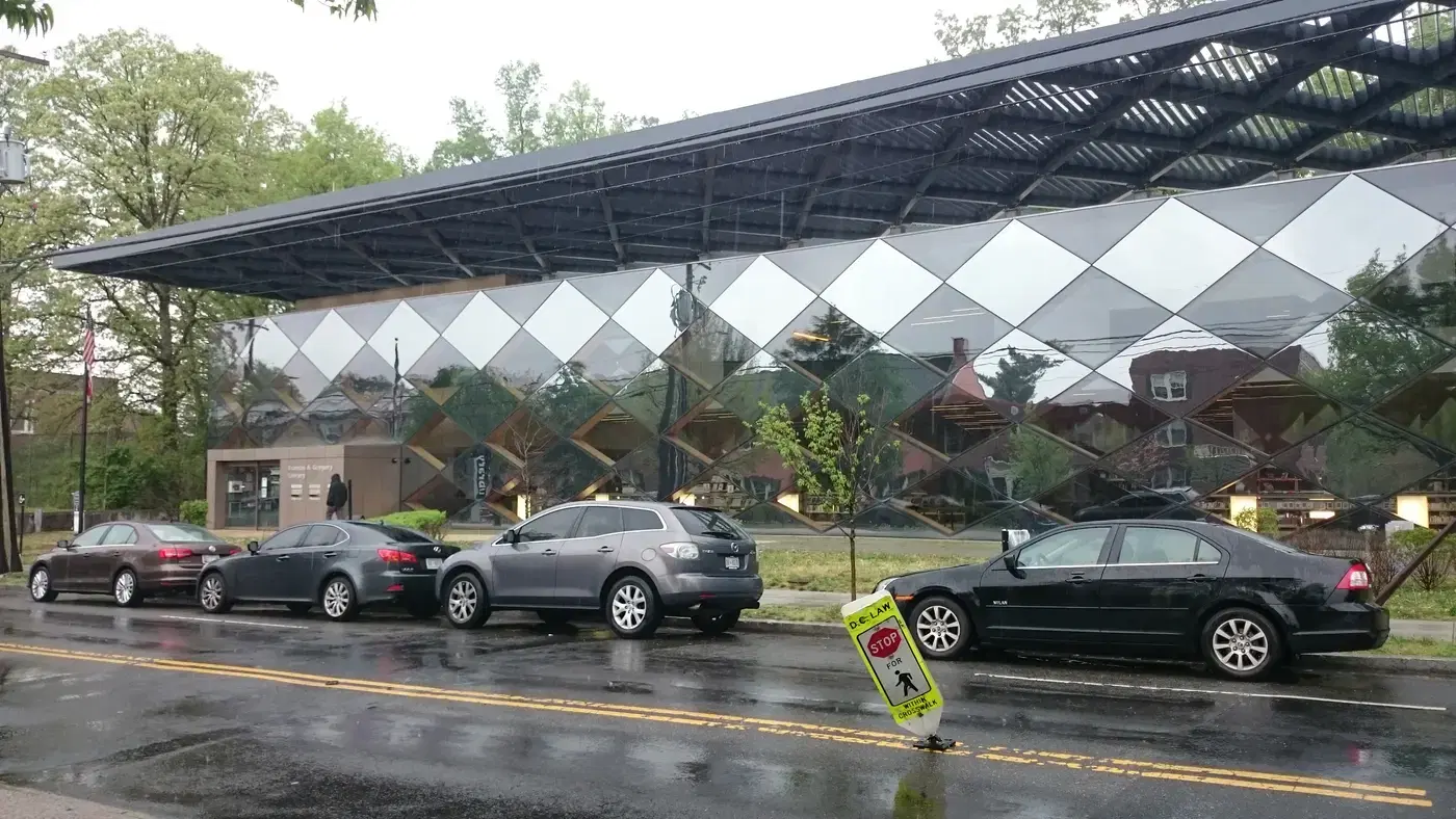 The mirrored glass facade and diamond-patterned canopy of the Francis A. Gregory Neighborhood Library, Washington, D.C.