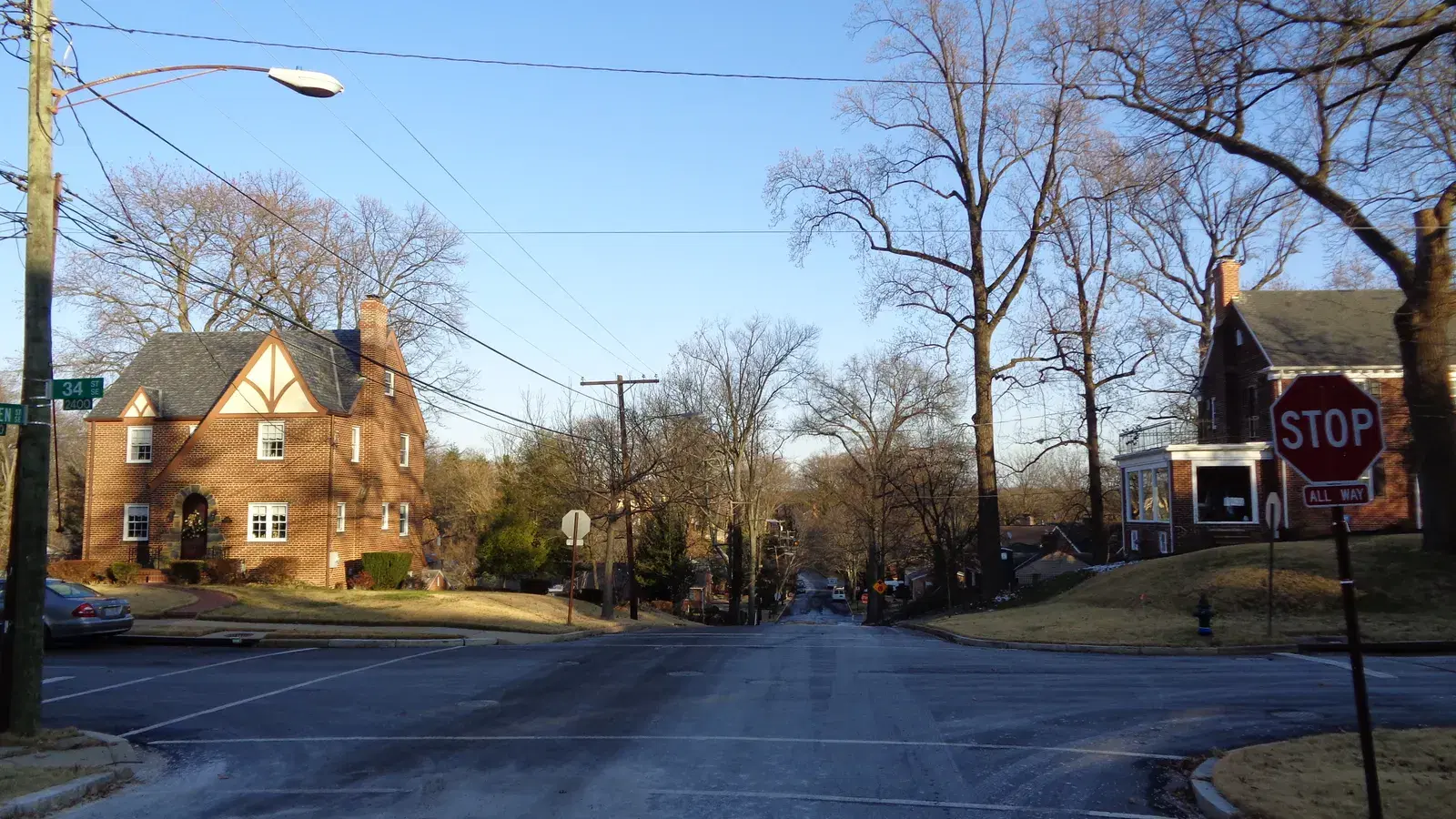 A brick Tudor house and winter trees at the corner of 34th and Camden Streets SE in Hillcrest, Washington, D.C.