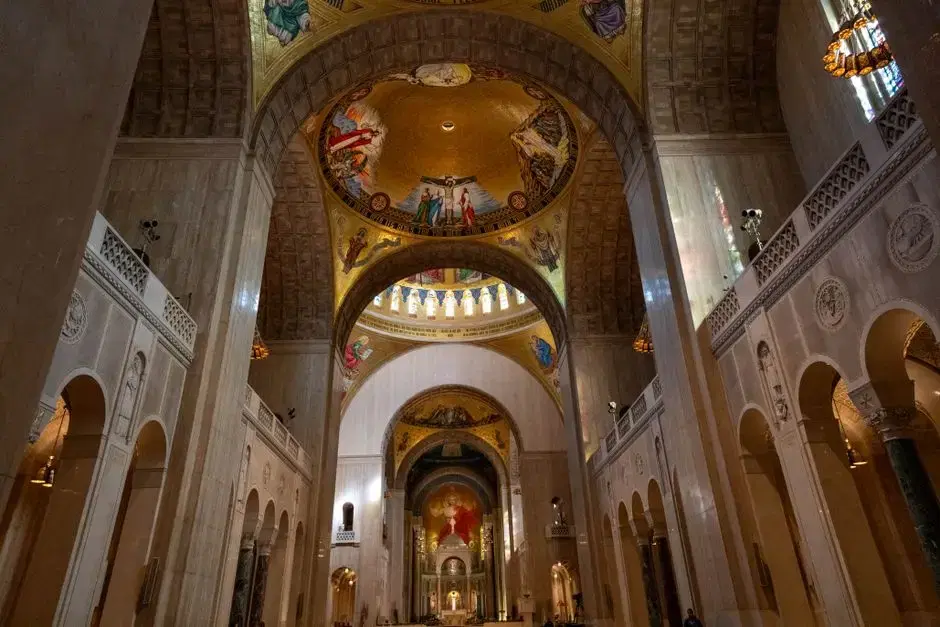 Actual Basilica of the National Shrine Great Upper Church nave with mosaic domes and Christ in Majesty apse