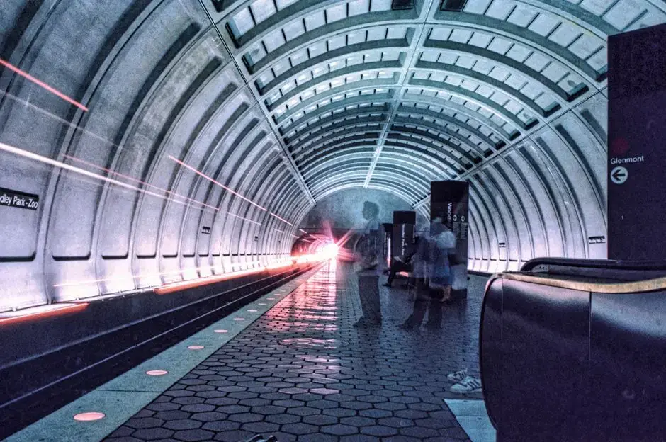 DC Metro platform (Woodley Park) long exposure with train light trails and Glenmont sign