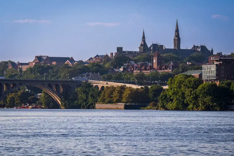 Actual Georgetown University — Healy Hall spires above Key Bridge and the Potomac; Pexels alt confirms