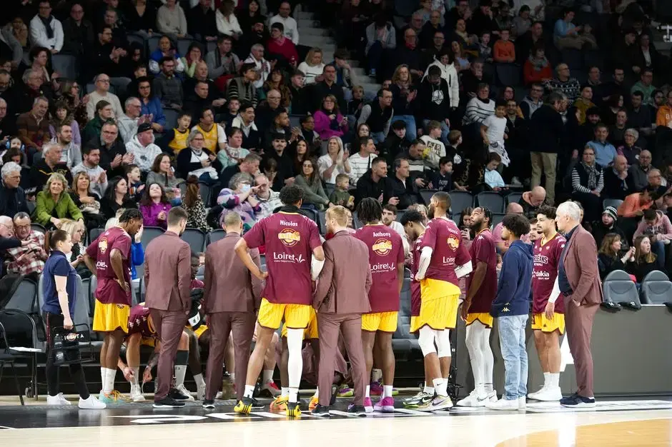 Pro basketball team huddle courtside with full crowd — game-night ambience (atmospheric; ESA itself not on Pexels)