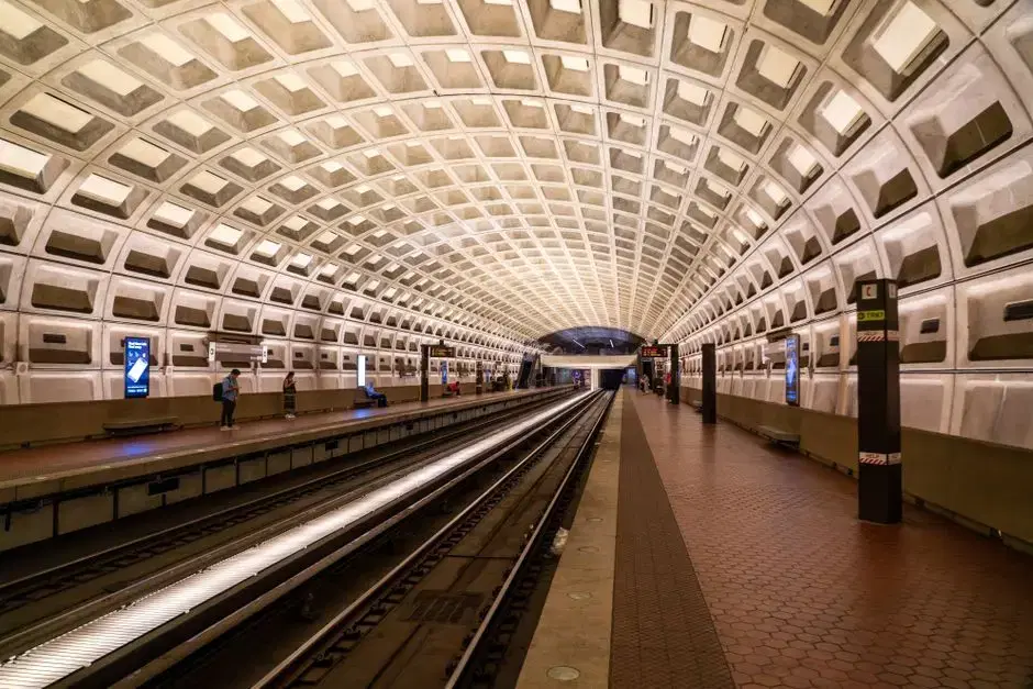 WMATA station with the signature coffered concrete vault — unmistakably the DC Metro, honest generic for the Green Line card