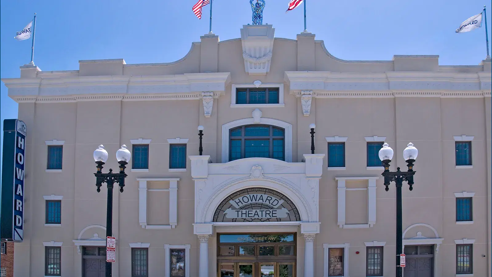 The restored facade of the Howard Theatre at 620 T Street NW in Shaw, Washington, D.C., with the U.S. and DC flags flying above the marquee.