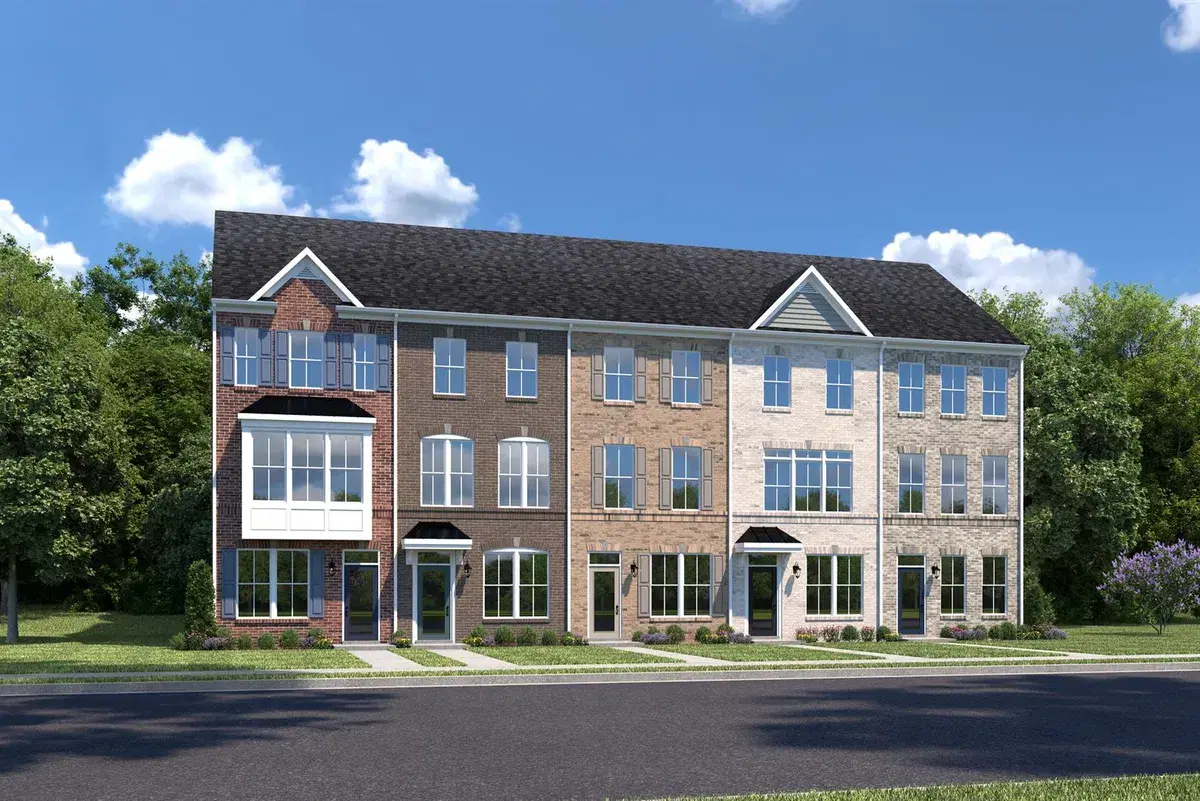 Rendering of a row of five brick Clarendon townhomes in different brick colors