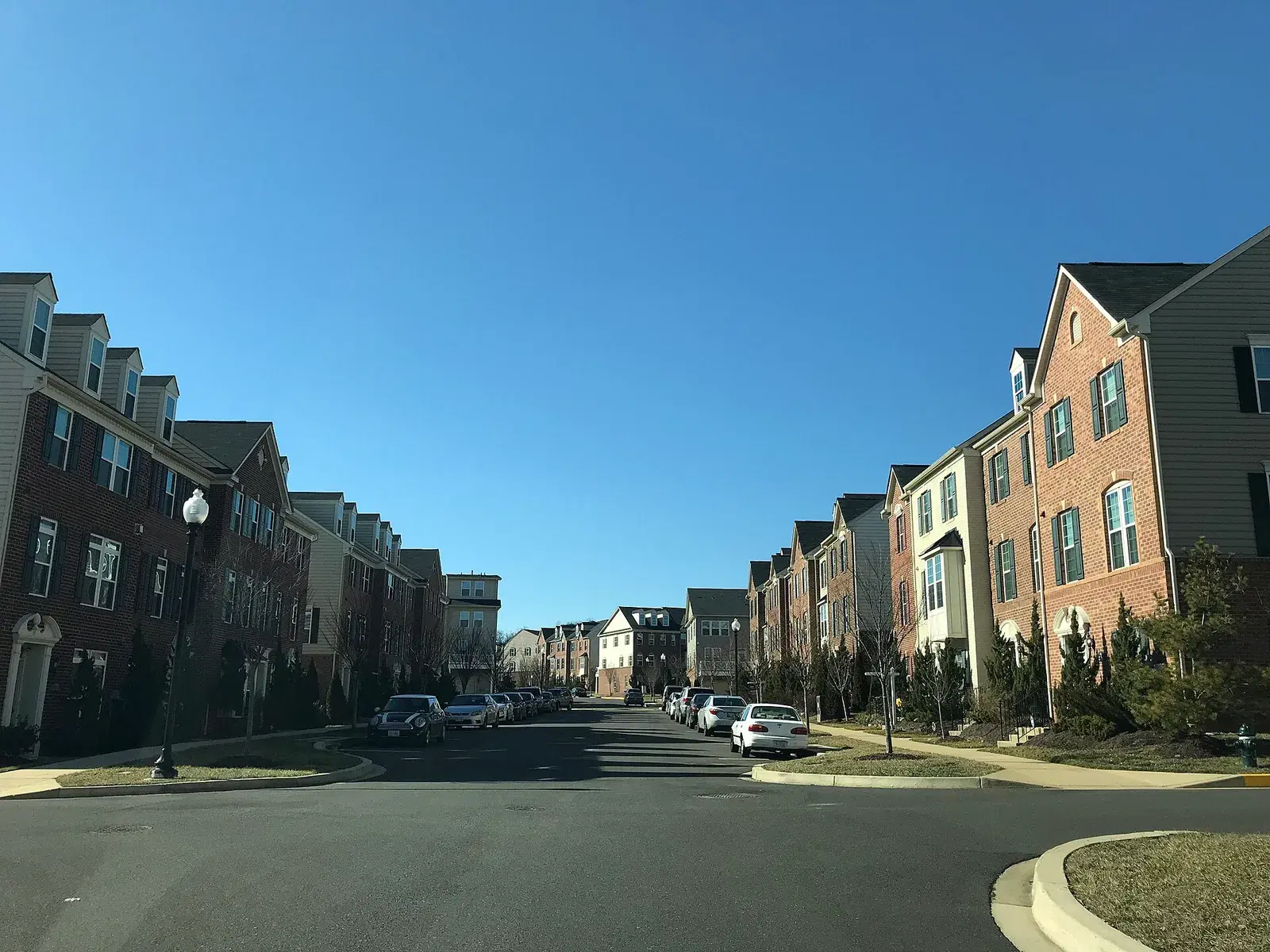 Rows of brick and siding townhomes along Hansberry Court NE in Fort Lincoln