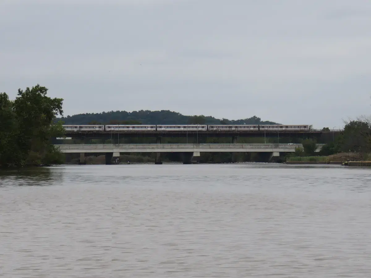 The Benning Road bridge over the Anacostia, with an Orange Line train on the Metro bridge beside it