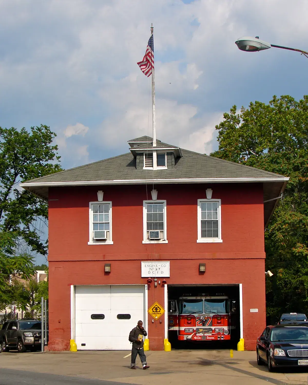 The red-brick Engine Company 27 firehouse on Minnesota Avenue NE, with its fire engine in the open bay
