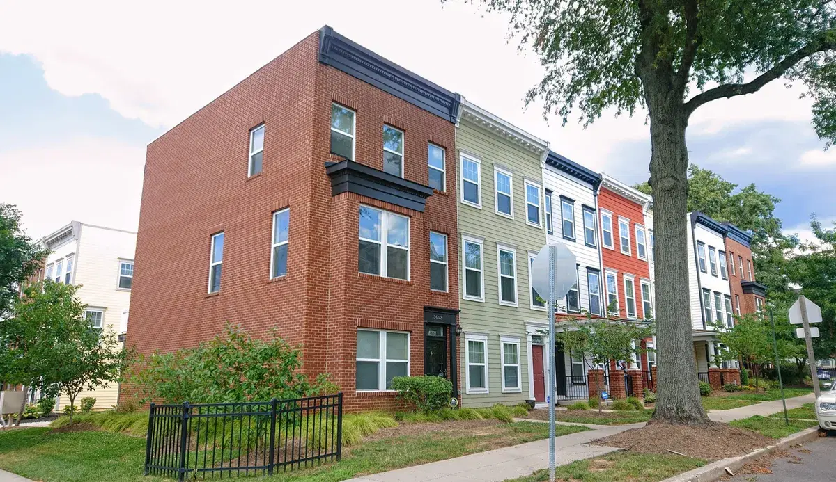 A row of new brick and painted townhouses in Parkside, near Minnesota Ave Metro