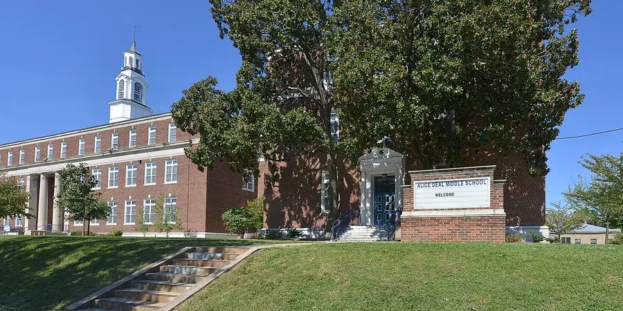 Alice Deal Middle School behind its lawn and trees on Fort Drive NW, Washington, D.C.