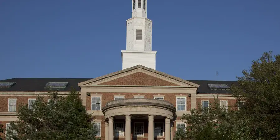 The columned portico and white 1932 tower of Theodore Roosevelt High School on 13th Street NW, Washington, D.C.