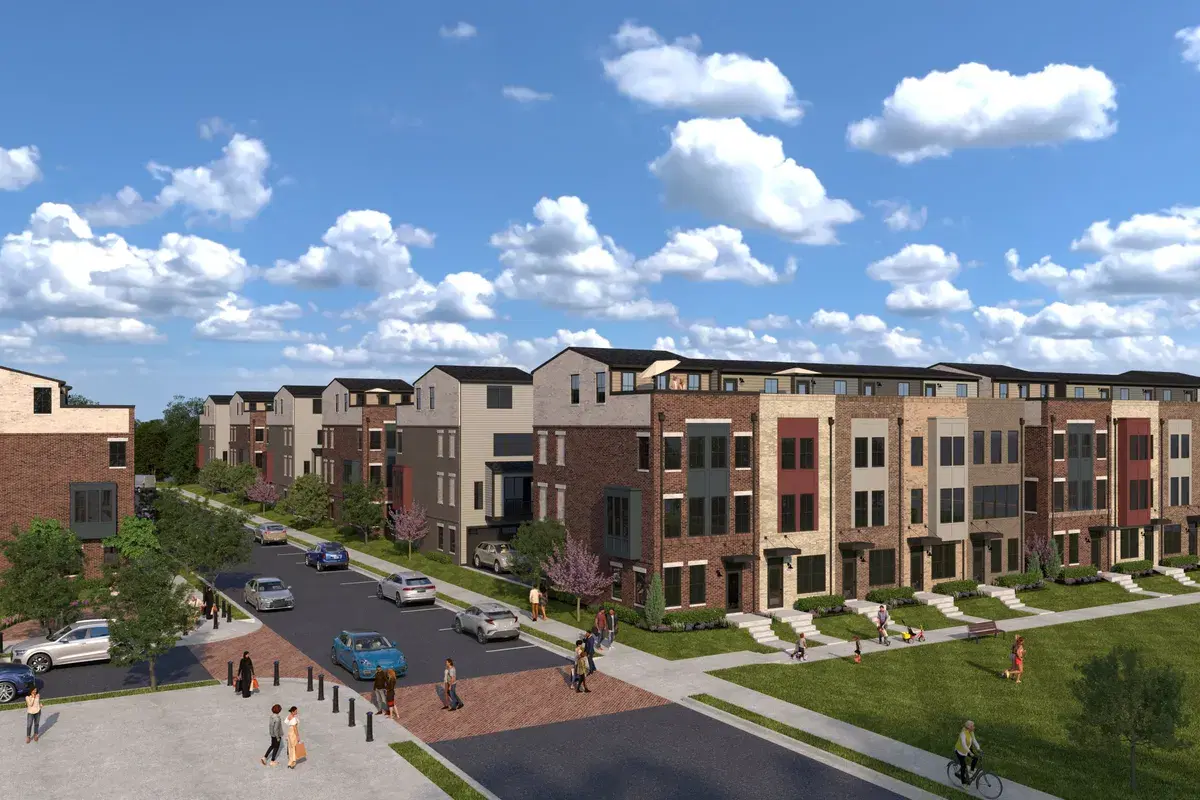 Rendering of rows of brick townhomes along a street and a lawn at Skyland Town Center