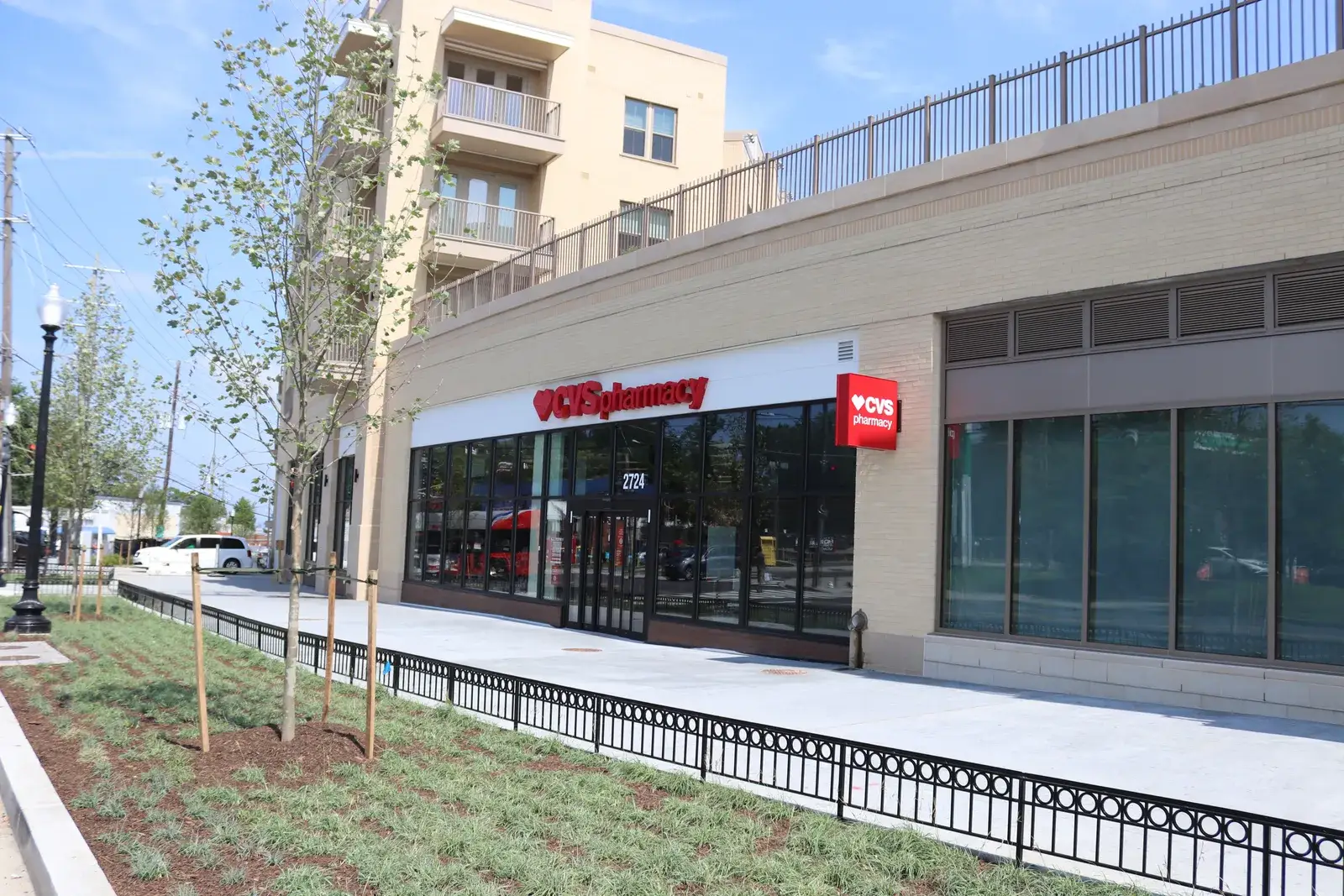 New street trees and a storefront along the sidewalk at Skyland Town Center