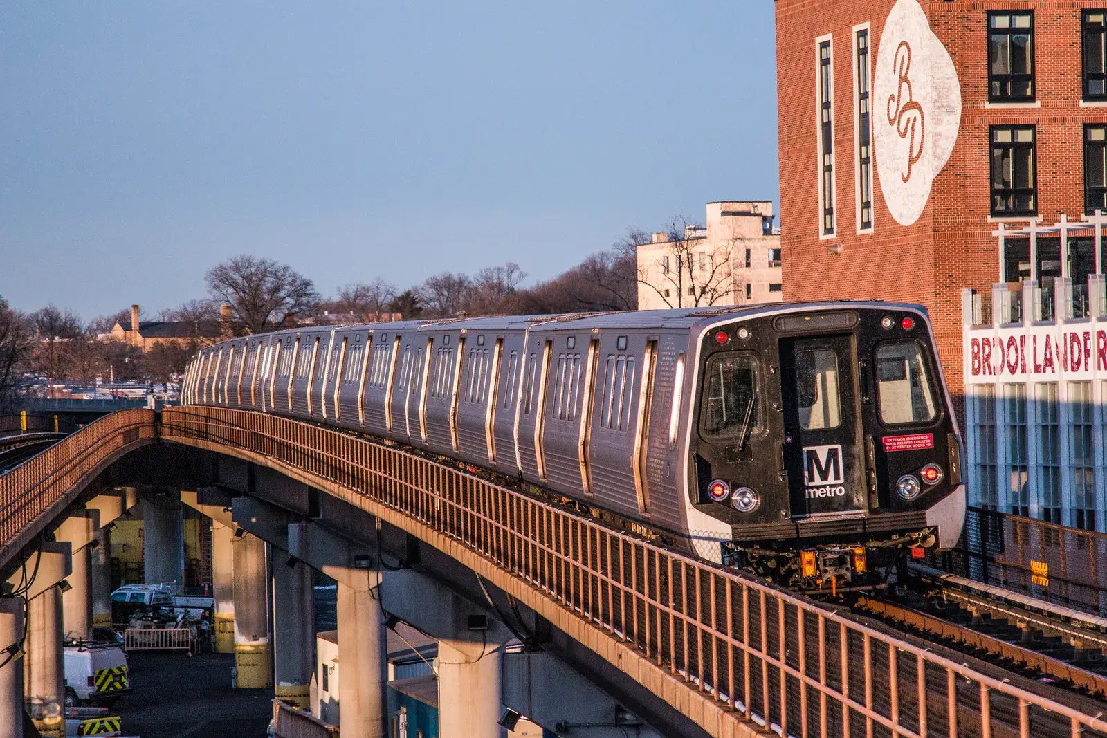 A Red Line train on the elevated tracks beside Rhode Island Ave–Brentwood station, Washington, D.C.